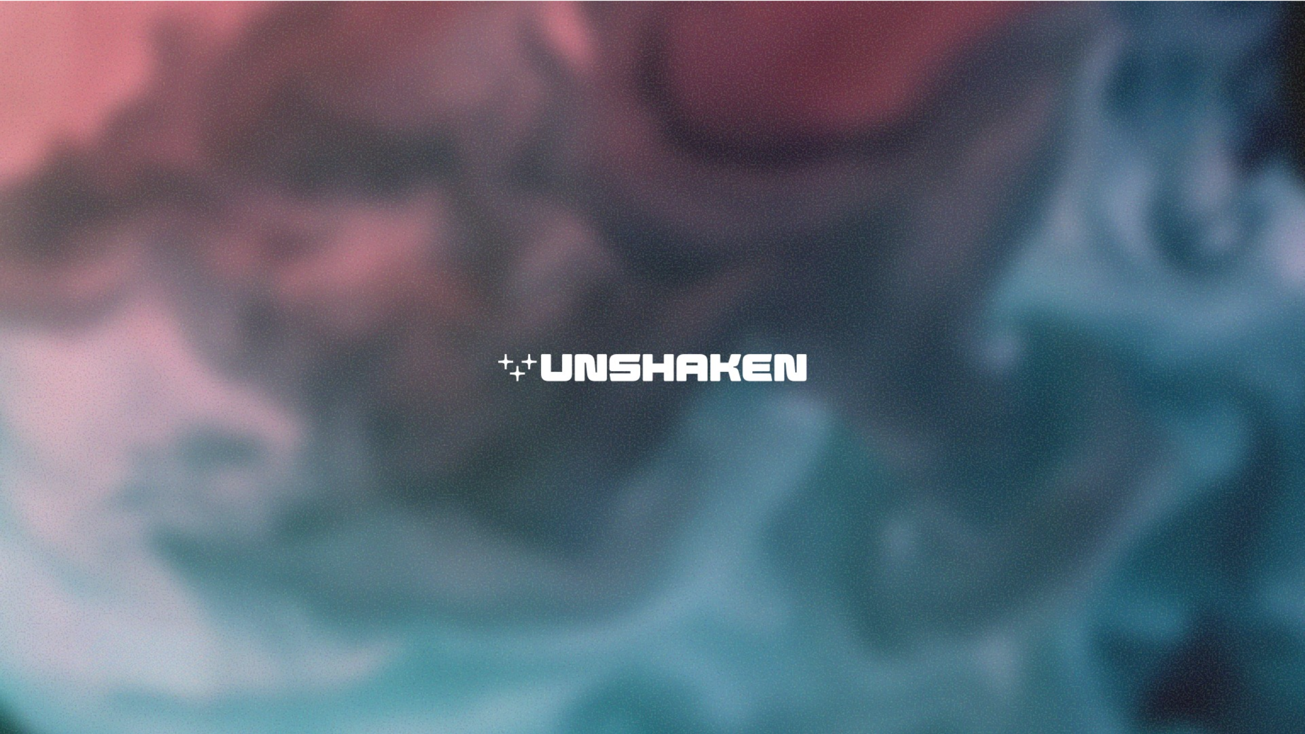 Blurred image with 'UNSHAKEN' logo overlay